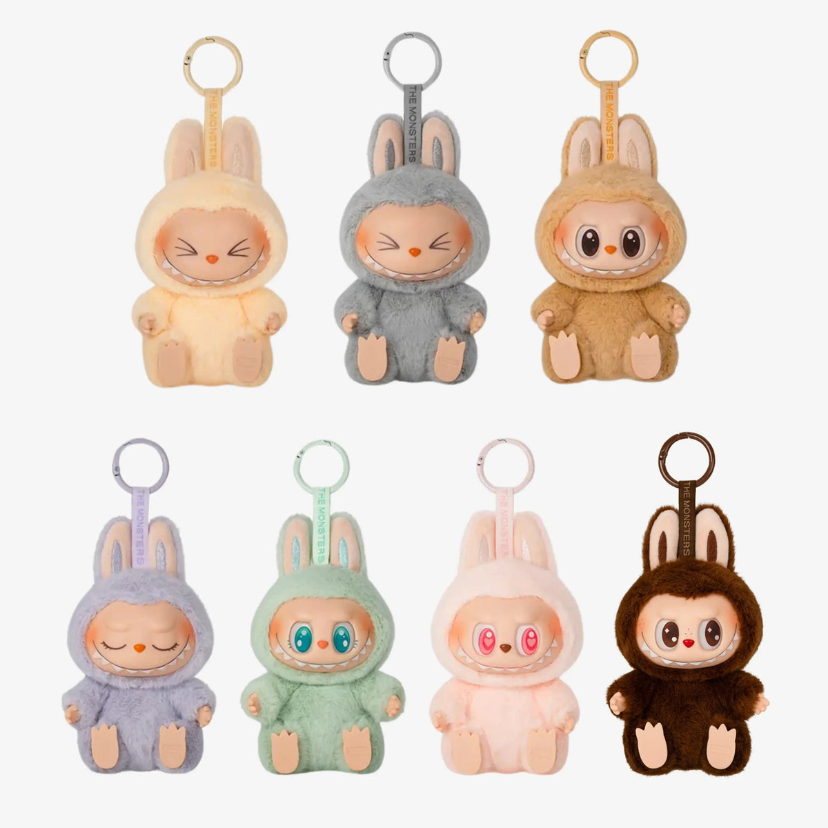 Labubu Popmart Have a Seat em versão sentada com roupinhas coloridas de coelho e chaveiro decorativo