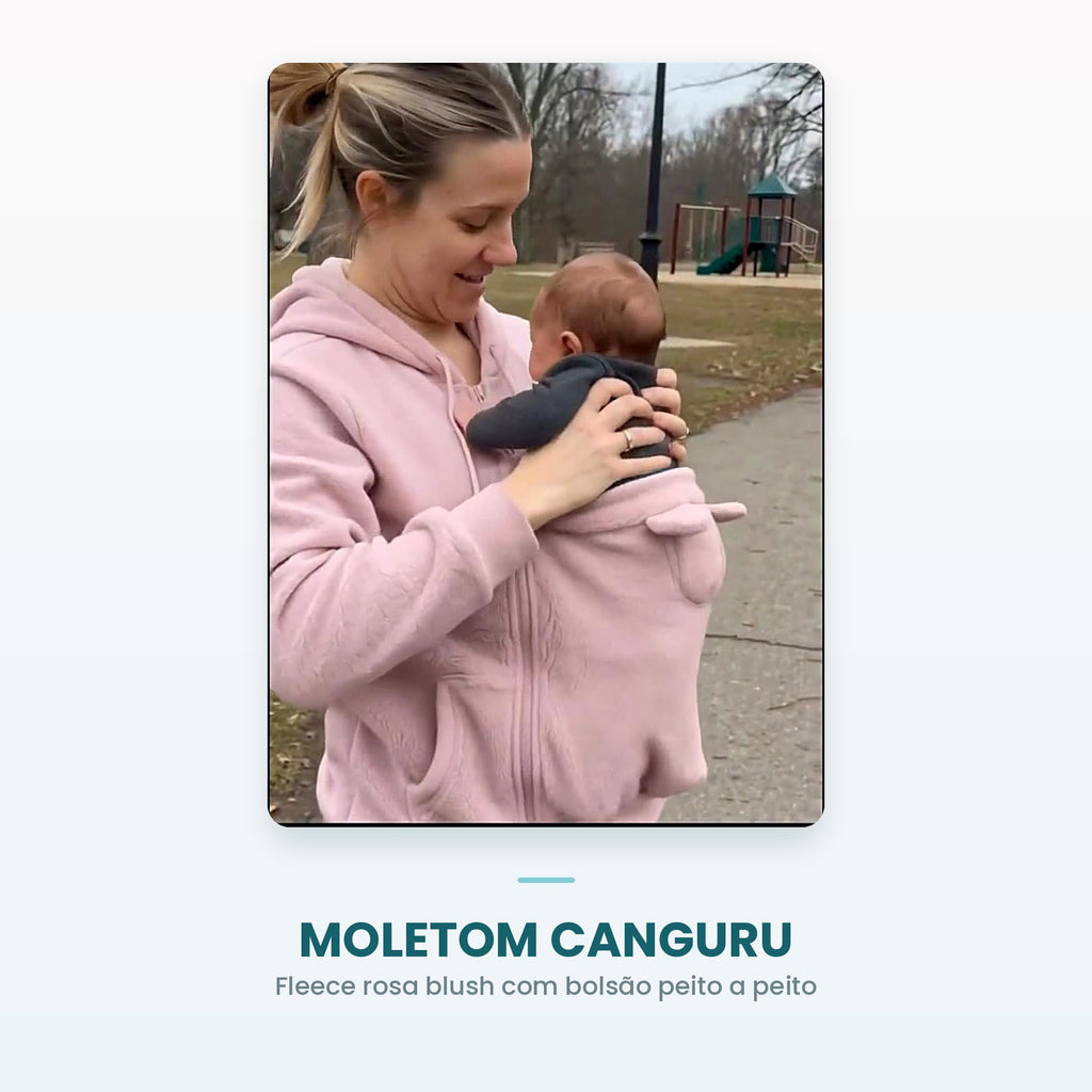 Mãe com bebê recém-nascido no bolsão do moletom canguru rosa fleece